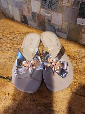 GUESS Rose Gold Bow Flip-Flop Sandals in Beige